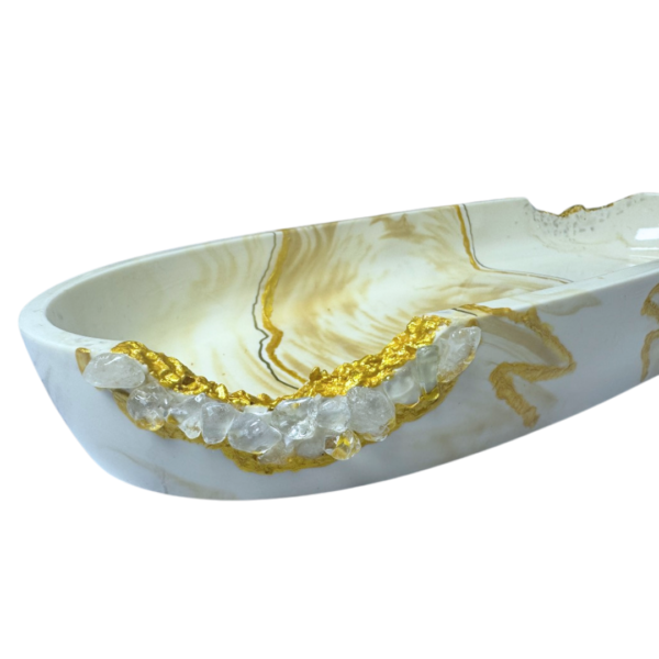 Close-up of Terra Wave Jesmonite Jewelry Storage with golden marbled design, Kintsugi-inspired detailing, and clear quartz crystal accents, handcrafted in Dubai, UAE