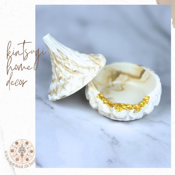 Open Celestial Jewel Cache, a handcrafted Jesmonite jewelry storage with golden marbled patterns, Kintsugi-inspired detailing, and a compact design, made in Dubai, UAE