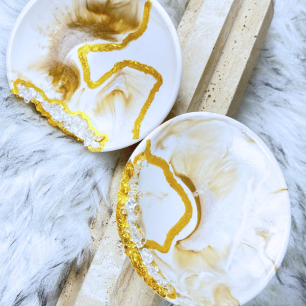 Pair of jesmonite Luminous Alchemy Pedestal Bowls with golden marbled design, Kintsugi-inspired accents, and quartz crystal embellishments, handcrafted in Dubai, UAE.